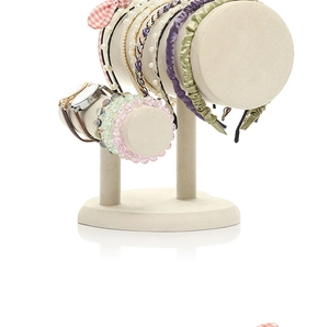 Close-up of beige velvet double-tier T-bar display stand for headbands and bracelets