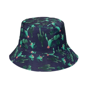 Detailed view of the dark blue fabric and green cactus pattern on the cotton sun hat