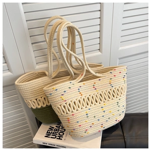 Close-up of woven tote bag texture with green contrast handle and colorful rope details
