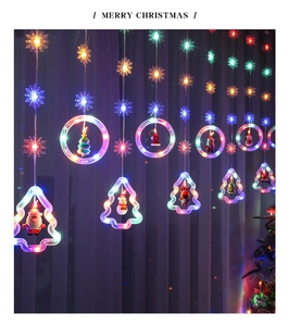 Close-up of LED Christmas curtain lights with Santa, snowman, and reindeer hanging ornaments