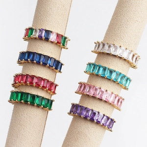 Minimalist gold rings set with colorful baguette cut zircons in eight vibrant shades