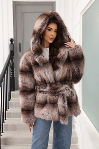Detail of hooded faux fur coat in brown gradient with waist belt and layered texture