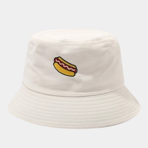 Detail of hot dog embroidery on a beige cotton bucket hat with fine stitching