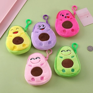 Close-up of colorful plush avocado coin purses with embroidery and carabiner clips