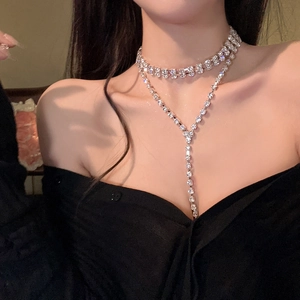 Detail view of silver double-layered choker necklace with sparkling fringe and crystals