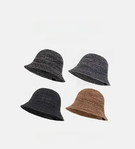Detail of four colors of breathable knitted bucket hats with textured crochet weave patterns