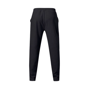 Rear view of black loose-fit joggers featuring an elastic waistband and athletic knit fabric