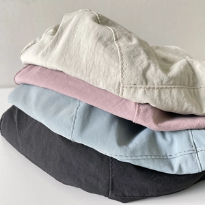 Foldable nylon bucket hats in beige, pink, blue, and black for women’s outdoor travel