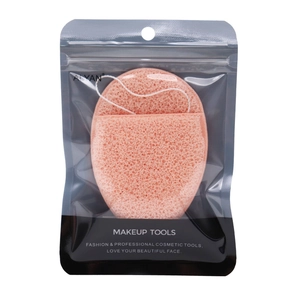 Pink heart-shaped facial sponge for cleansing and makeup removal in a clear bag