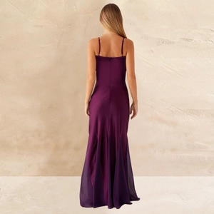 Detail of slim fit dark purple satin evening dress with spaghetti straps and mermaid hem