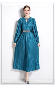 Detail of beaded neckline and pleated waist on this peacock blue long-sleeved dress