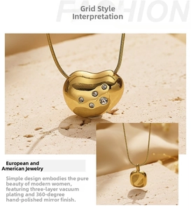 Detail of gold bean pendant featuring micro-set zircons and mirror polished finish