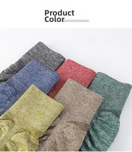 Detail of multi-color breathable knitted yoga shorts showing fabric texture and mesh