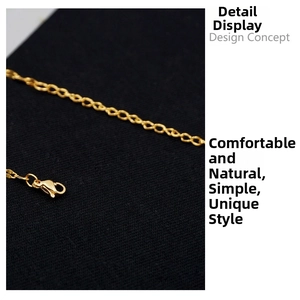 Detailed close-up of golden metal lip chain necklace with high-quality lobster clasp buckle