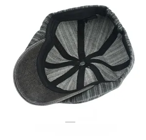 Detail view of cotton striped beret cap interior with reinforced stitching and elastic band