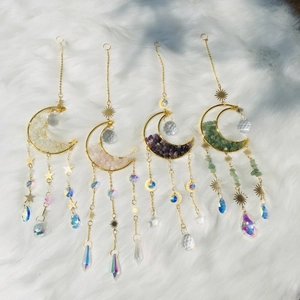 Detailed set of four golden moon crystal suncatchers with amethyst and quartz stones
