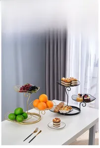 Close-up of a three-tier Nordic iron fruit basket with elegant curved metal support
