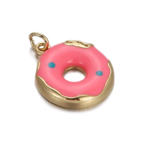 Close-up of a gold-plated doughnut charm with pink enamel and blue zircon details