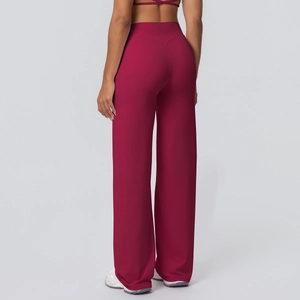 Detail of high waist wide leg yoga pants showing the back V-shape stitching and red fabric
