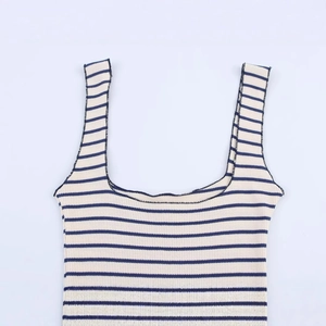 Women's sleeveless striped knit dress featuring white and blue ribbed cotton fabric