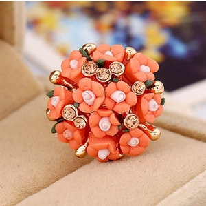 Detailed close-up of rose flower stud earrings with ceramic petals and crystals