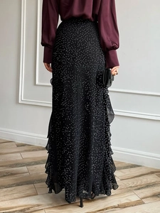 Elegant black polka dot maxi skirt with ruffle trim detail for casual vacation wear