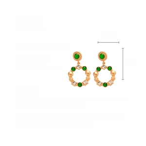 Detailed view of vintage gold-tone resin earrings with rhinestones measuring 6cm by 3.5cm