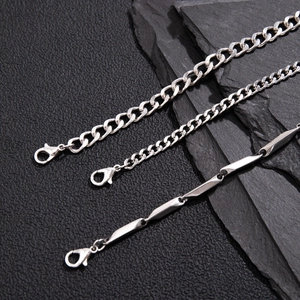 Three men's silver titanium steel chain bracelets set displayed on black leather background
