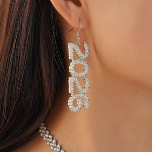 Detail shot of silver geometric water drop earrings with 2020 diamond numbering