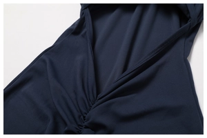 Close-up of the pleated V-neckline and textured fabric on the yoga jumpsuit