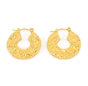 Detail of 18K gold-plated hoop earrings with unique hammered texture and lava pattern
