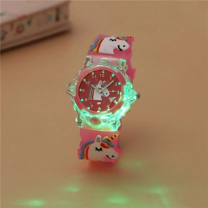 Pink kids watch featuring a glowing green LED display and 3D silicone unicorn motifs