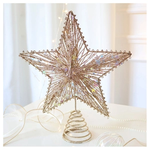 Detailed champagne gold hollow wire star tree topper with sequins and spiral base