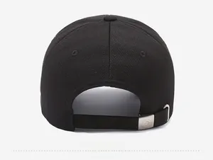 Close-up of the adjustable silver metal buckle on the back of the black baseball cap