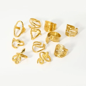 Macro shot of 11-piece 18K gold plated stainless steel ring set with geometric shapes