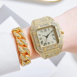 Close-up of gold square watch with crystal bezel and matching rhinestone Cuban bracelet
