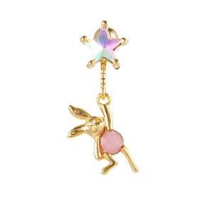Macro view of gold rabbit stud earring with colorful star and pink enamel detail