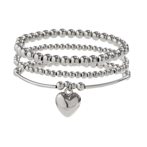 Detail showing tiered silver beaded bracelets with a polished heart charm on white background