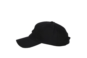 Close-up of side white letter embroidery on black cotton baseball cap with vent holes