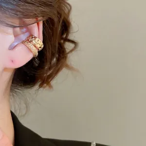 Minimalist double layered gold ear cuffs with irregular hammered and frosted textures