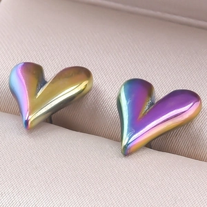 Macro shot of iridescent heart earrings in 304 stainless steel with rainbow finish