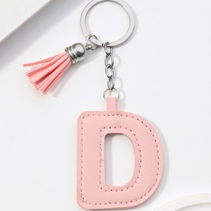 Pink PU leather letter D keychain with elegant matching tassel and gold-tone metal ring