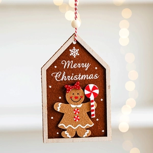 Close-up of wooden gingerbread man ornament with felt inlay and Merry Christmas text