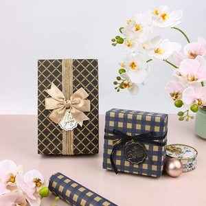 Vintage blue and black grid kraft gift wrap boxes with elegant ribbon and floral accents