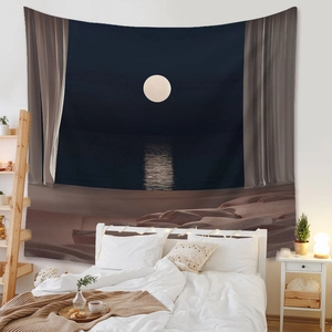 Detailed close-up of bohemian ocean moon tapestry hanging as a bedroom wall backdrop