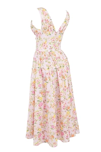 Detail of pink floral dress back showing zipper closure and pleated fabric texture