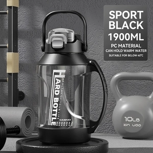 Detail of 1900ml sports water bottle with handle and flip lid in a gym setting