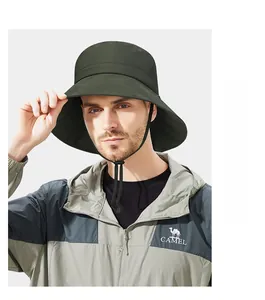 Detail of dark green wide-brim sun hat with adjustable windproof cord and waterproof fabric