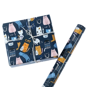 Navy blue wrapping paper with colorful cartoon cat patterns for birthday gifts