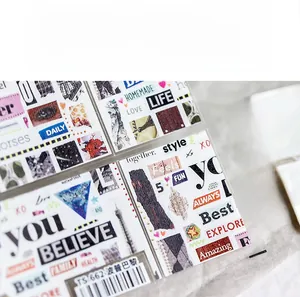 Detail shot of vintage pop-style nail art stickers with retro typography and illustrations